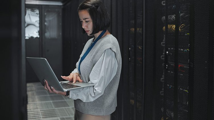 A young girl working on laptop