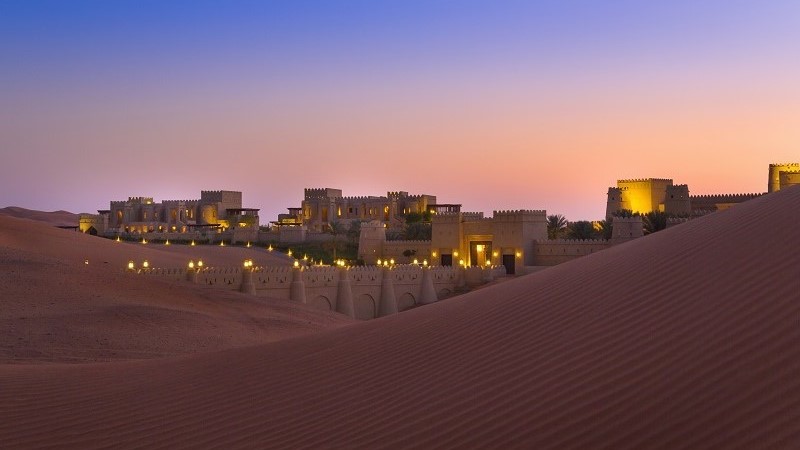 royal palace in the middle of sand dunes 