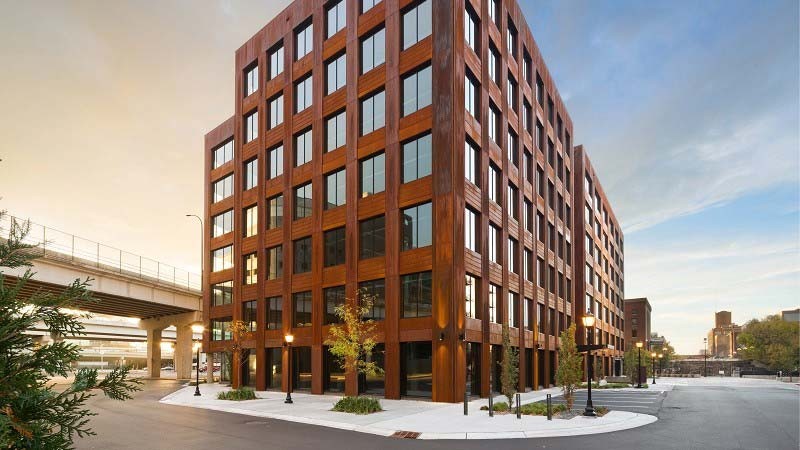 Wooden skyscarper building with multiple windows 