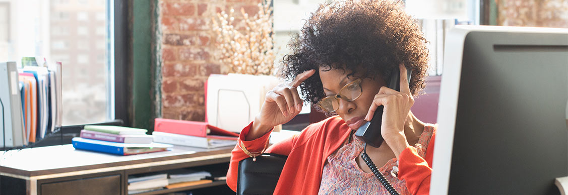 Woman talking on a telephone